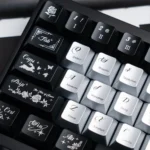 Explore the Night Butterfly Iridescent PC Keycap Set from multiple angles, revealing its luxurious pearlescent metallic finish and deep, shimmering hues.