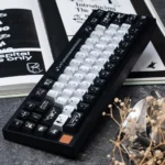 A collection of Night Butterfly Iridescent PC Keycaps set from various angles, showcasing their shimmering pearlescent metallic finish and deep, elegant hues.