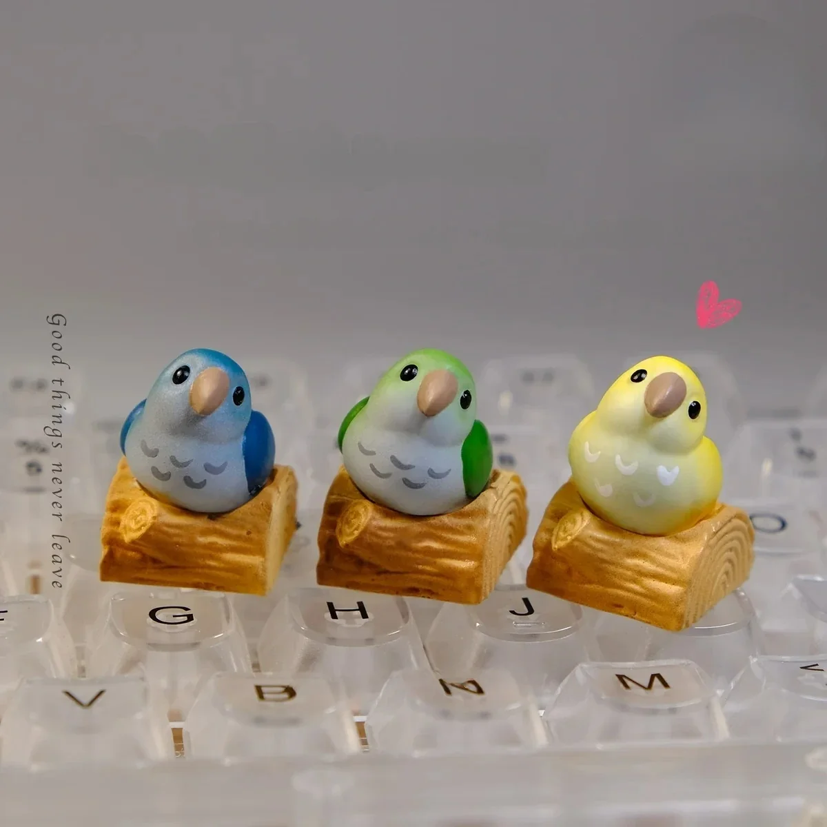 Vibrant hand-sculpted Monk Parrot artisan keycap for mechanical keyboards, showcasing whimsical 3D art and a charming touch of nature.