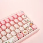Detailed view of the whimsical Patrick Star PBT MOA keycaps set, highlighting their vibrant pink dye-sublimated designs and ergonomic profile for comfortable design.
