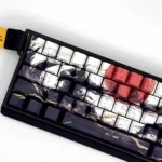 Sunset War side-printed PBT keycap set. Durable PBT, vibrant dye-sublimated graphics, battle-worn aesthetic, dramatic sunset hues. Multiple angles.