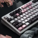 Close-up view of the Mysterious Gauze Pink Dimple Aesthetic PBT Keycaps Set, showcasing the unique shimmering pearl metal finish and sophisticated soft Pilates.