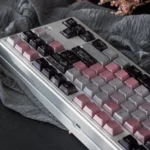 Mysterious Gauze Pink Dimple Aesthetic PBT Keycaps Set, viewed closely. Its unique shimmering pearl metal finish exudes sophisticated elegance.