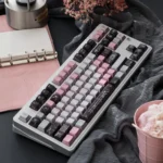 Aesthetic PBT keycaps set showcasing the unique Gauze Pink Dimple pearl metal finish against a deep, elegant backdrop.