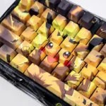 Vibrant Pikachu PBT backlit keycaps set showcase iconic graphics from multiple angles, highlighting luminous side-engraved legends for a playful look.