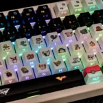 Premium Characters keycap set close-up from an artistic angle, highlighting its vibrant side-lit RGB glow and iconic translucent design illuminated by keyboard.