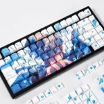 Premium Gojo Satoru PBT keycaps set, showcasing luminous side-printed legends and enigmatic aesthetics on a backlit keyboard.