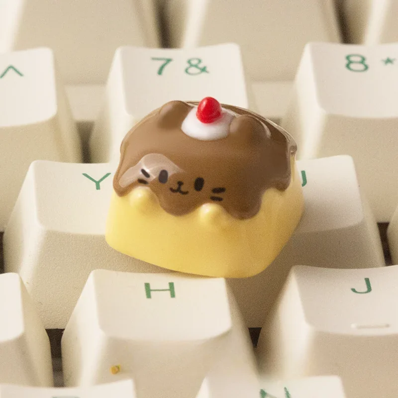 Handcrafted Pudding Cat Keycap made of translucent resin, showcasing a whimsical 3D feline design. This unique artisan ESC keycap adds playful charm.