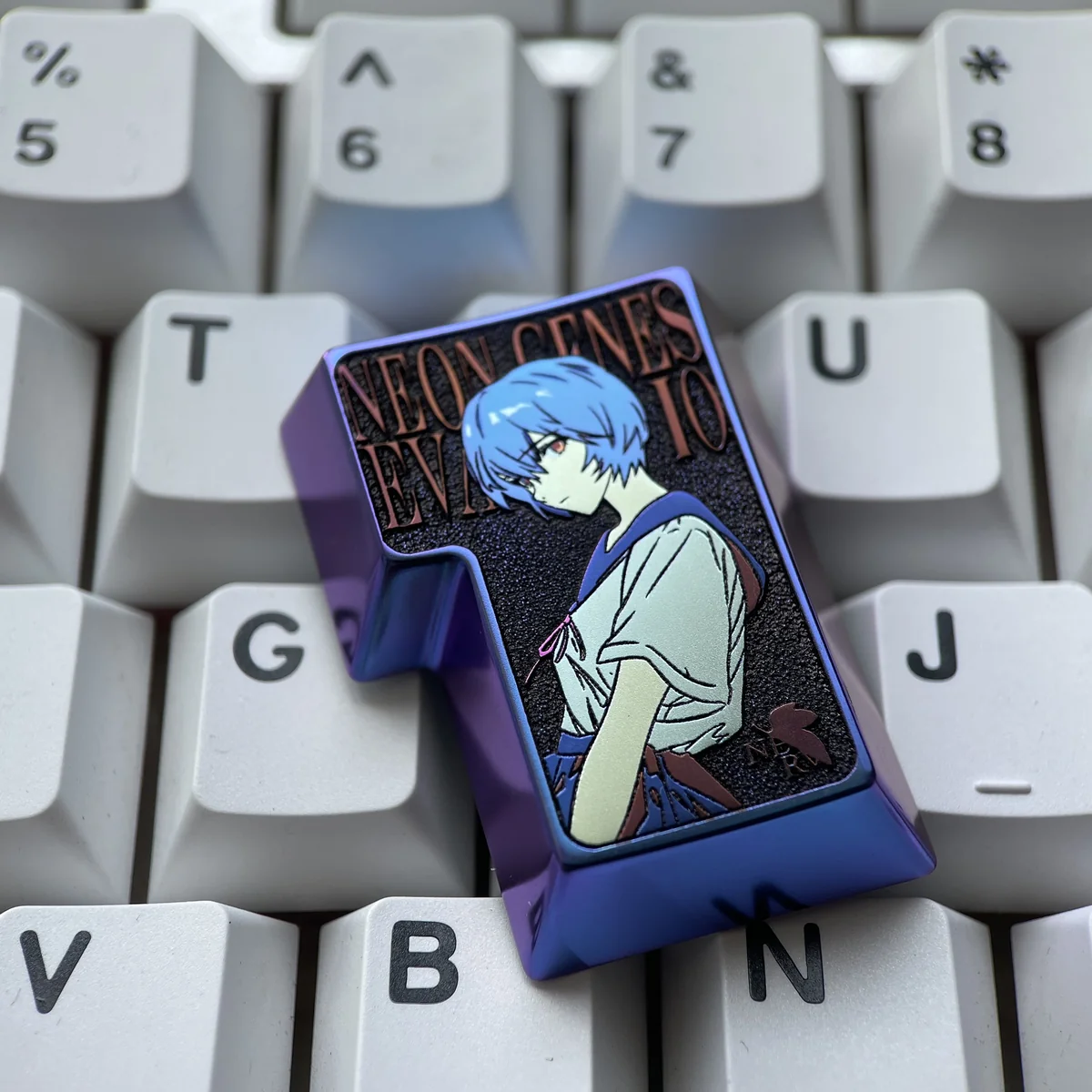 Gallery view of the premium Rei Ayanami Titanium 3D artisan keycap, highlighting its iconic sci-fi relief and elegant metallic finish from all angles.