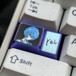 Multiple angles of the premium Rei Ayanami Titanium 1.75U Caps Lock keycap, showcasing its intricate mecha-anime details and anodized metallic finish.