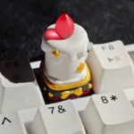 Handcrafted resin candle keycap, showcasing its whimsical miniature candle form, layered resin, and intricate details. A unique artisan desktop charm design.