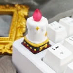 Handcrafted resin candle keycap. Whimsical layered design, ethereal glow, and intricate details from multiple angles. Unique artisan desktop charm.
