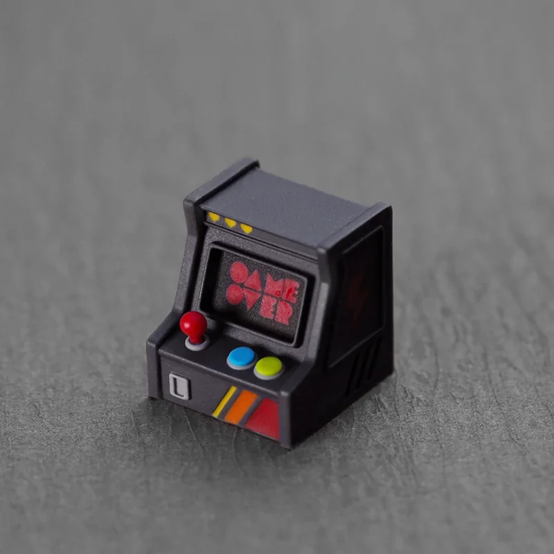 Handcrafted backlit retro game console keycap, arcade ESC design. Multiple views reveal vibrant resin, illuminated miniature console details, and premium artistic design.