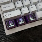 Multiple angles of the handcrafted Chainsaw Man Reze titanium artisan keycap, emphasizing its dynamic character design and sleek, premium anime aesthetics.