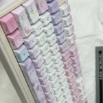 This artistic PBT keycap set, 120-key Cherry profile, displays tranquil muted blue ripples and crisp calligraphic dye-sublimated legends.