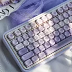 Romantic Twilight PBT dye-sub keycaps set showing ethereal gradient purples from multiple angles. Romantic keycaps with full five-sided dye-sub for a dreaming design.