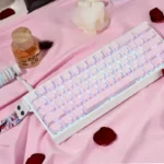 Artistic view of Rose Coast luminous side-engraved PBT keycaps set, showcasing serene pink, orange, and grey gradients with ambient glow.