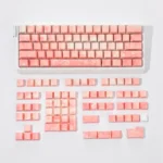 Rose Coast Luminous Side-Engraved PBT Keycap Set in a vibrant orange gradient, evoking serene coastal sunsets with a soft ambient glow for a complete design.