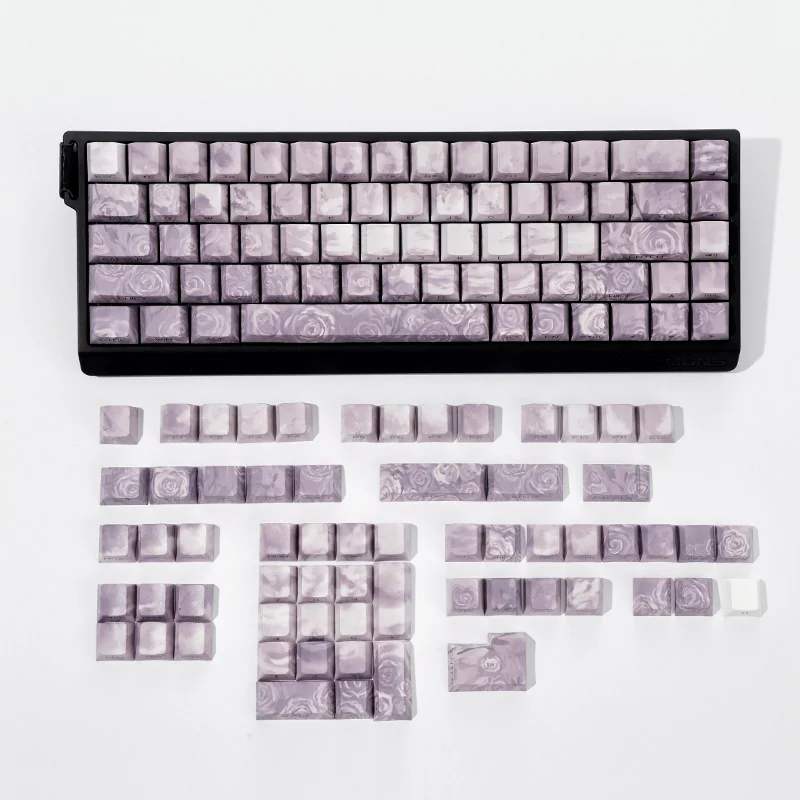 A serene grey Rose Coast PBT keycap set, featuring luminous side-engraved legends evoking tranquil coastal artistry.
