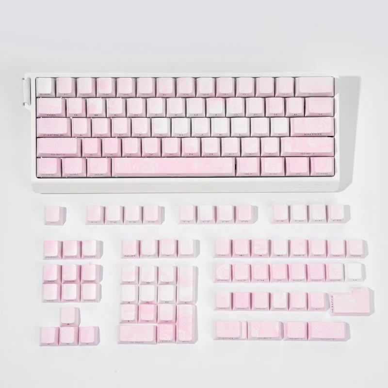 A captivating pink Rose Coast Luminous Side-Engraved PBT Keycap Set (131 keys) showcasing a serene coastal gradient with ambient backlighting.