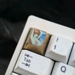 Artistic gallery views of the Asuka Titanium ESC Keycap, showcasing the vibrant Shy Summer design and premium titanium from multiple angles.