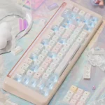 Close-up of Summer Daydream Keycaps Set, featuring ethereal translucent PBT PC blend and soft pastel gradients, evoking a tranquil summer aesthetic.