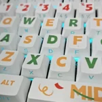 Close-up of vibrant Summer Party PBT keycaps set, showcasing playful side-printed, translucent legends in Cherry profile for a backlit keyboard.