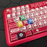 Gallery of iconic Super Mario Family Computer PBT Dye-sub keycaps set, showing vibrant 8-bit characters and playful Famicom designs from multiple angles.
