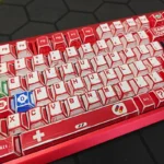 Vibrant Super Mario Family Computer PBT dye-sub keycaps set featuring iconic 8-bit characters and console elements from various playful angles.