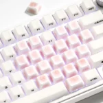 Handcrafted delicate Ice Crack Heart-Shaped Cherry Supplement Keycap Set featuring intricate ice crack patterns and charming heart motifs, showcased from multiple artistic angles.