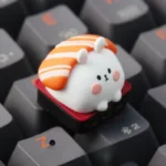Handcrafted sushi rabbit ESC keycap shown from multiple angles, highlighting its whimsical resin art, vibrant colors, and layered epoxy depth.