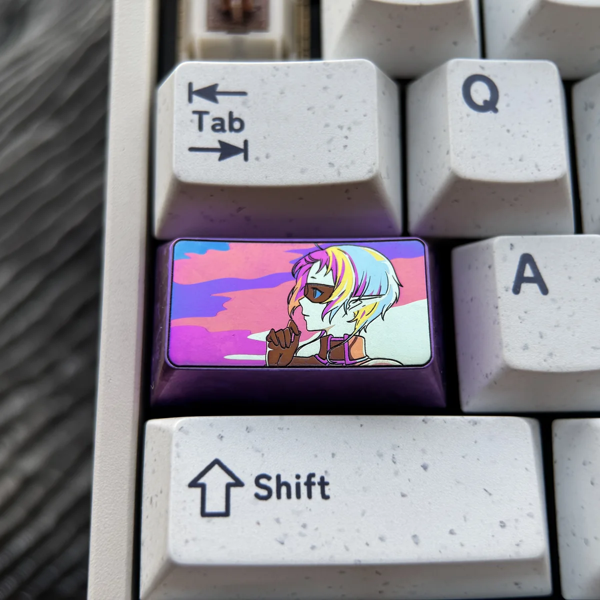 Close-up of the premium titanium Sylphiette artisan keycap, a vibrant 1.75u shift showcasing the iconic anime character's artistic design.