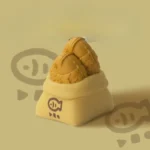 Whimsical golden-brown Taiyaki artisan ESC keycap, handcrafted from detailed resin, showcasing its miniature culinary art from multiple angles.