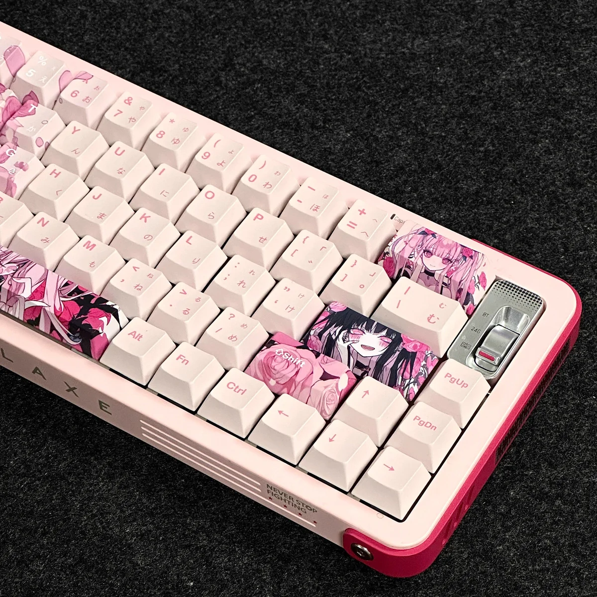 A close-up view of the Charming Tang PBT Dye-Sub Keycap Set, highlighting the exclusive anime-inspired art and intricate details with a soft color.