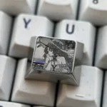 Close-up views of the Cartethyia precision engraved titanium keycap, showcasing its intricate metallic patterns and aerospace-grade craftsmanship from various angles.
