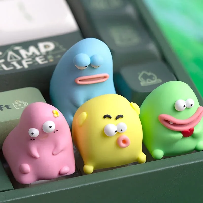 Vibrant, handcrafted Ugly Cute Keycap made from unique resin, showcasing its playful, abstract character design and charming texture.