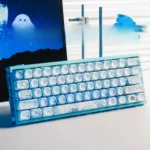 Detail view of the immersive PBT Dye-Sub underwater keycaps set, highlighting vibrant blue marine life and serene coral reef artistry.