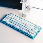 Close-up of an immersive PBT Dye-Sub underwater keycap set showcasing vibrant blue coral and intricate marine life, part of the serene deep ocean set.