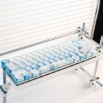 Immersive PBT dye-sub underwater keycaps set showing vibrant blue marine life and coral designs from multiple artistic angles.