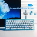 Immersive PBT Dye-Sub Underwater Keycaps Set, displaying vibrant blue marine life and intricate coral reef art from a captivating angle.