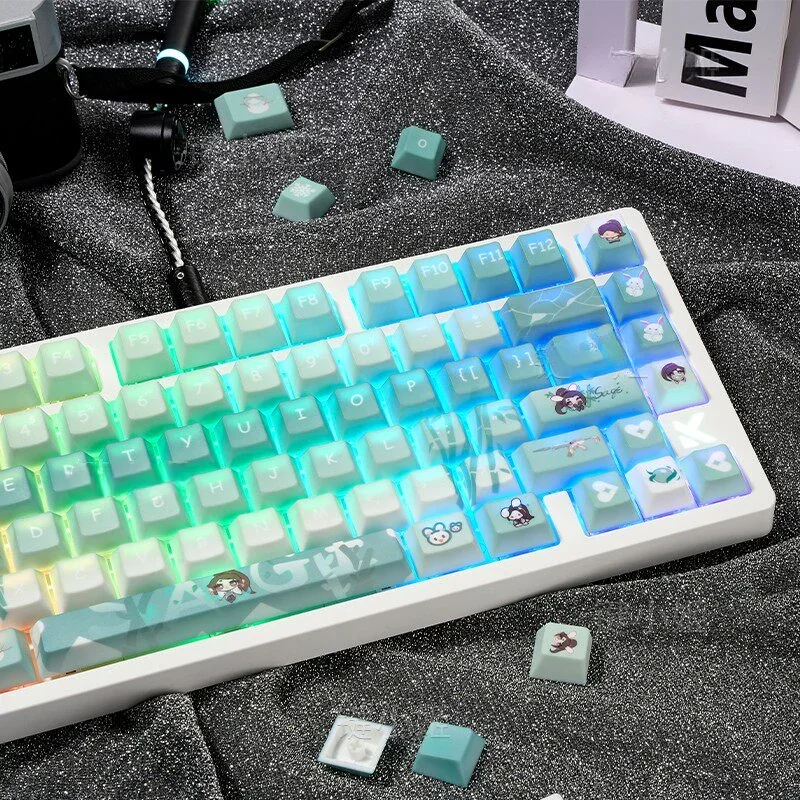 Close-up of Valorant Sage PBT dye-sublimated keycaps set from various angles, highlighting the serene green and white character art and tactical game motif.