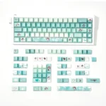 An array of Valorant Sage PBT dye-sub 131-keycaps set, displayed from multiple perspectives to showcase their serene green and white design and crisp character.