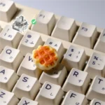 Whimsical handcrafted waffle keycap for MX switches, captured in a product gallery showcasing its delightful miniature sculpture from various angles,