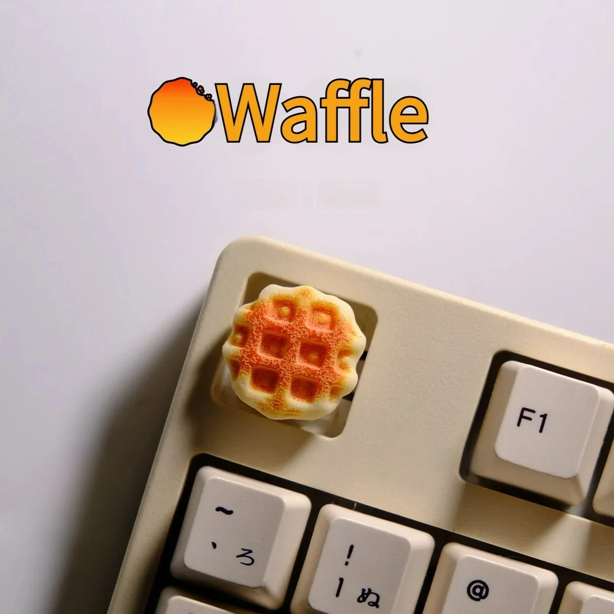 A delightful, handcrafted waffle keycap for MX switches, showcasing a miniature, realistic waffle sculpture with warm, inviting textures and colors.