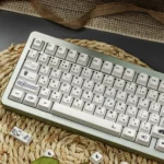 Multiple artistic views of the Subtle Multi-Tone White Zen PBT Keycaps Set, highlighting its clean lines, harmonious design, and natural aesthetic.