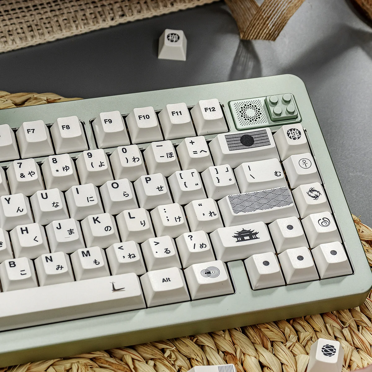 Subtle multi-tone white Zen PBT keycaps set from various angles, showcasing clean lines and harmonious, natural design for an artistic keyboard aesthetic.