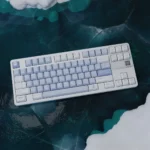 Winter Serenity PBT keycaps set reveal frosty blue, crisp white, and cool gray tones. Durable Cherry profile set offers a tranquil, snowy aesthetic.