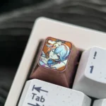 Premium Wuthering Waves Camellya titanium artisan keycap displayed from various angles, showcasing its intricate metallic design and lustrous detail.