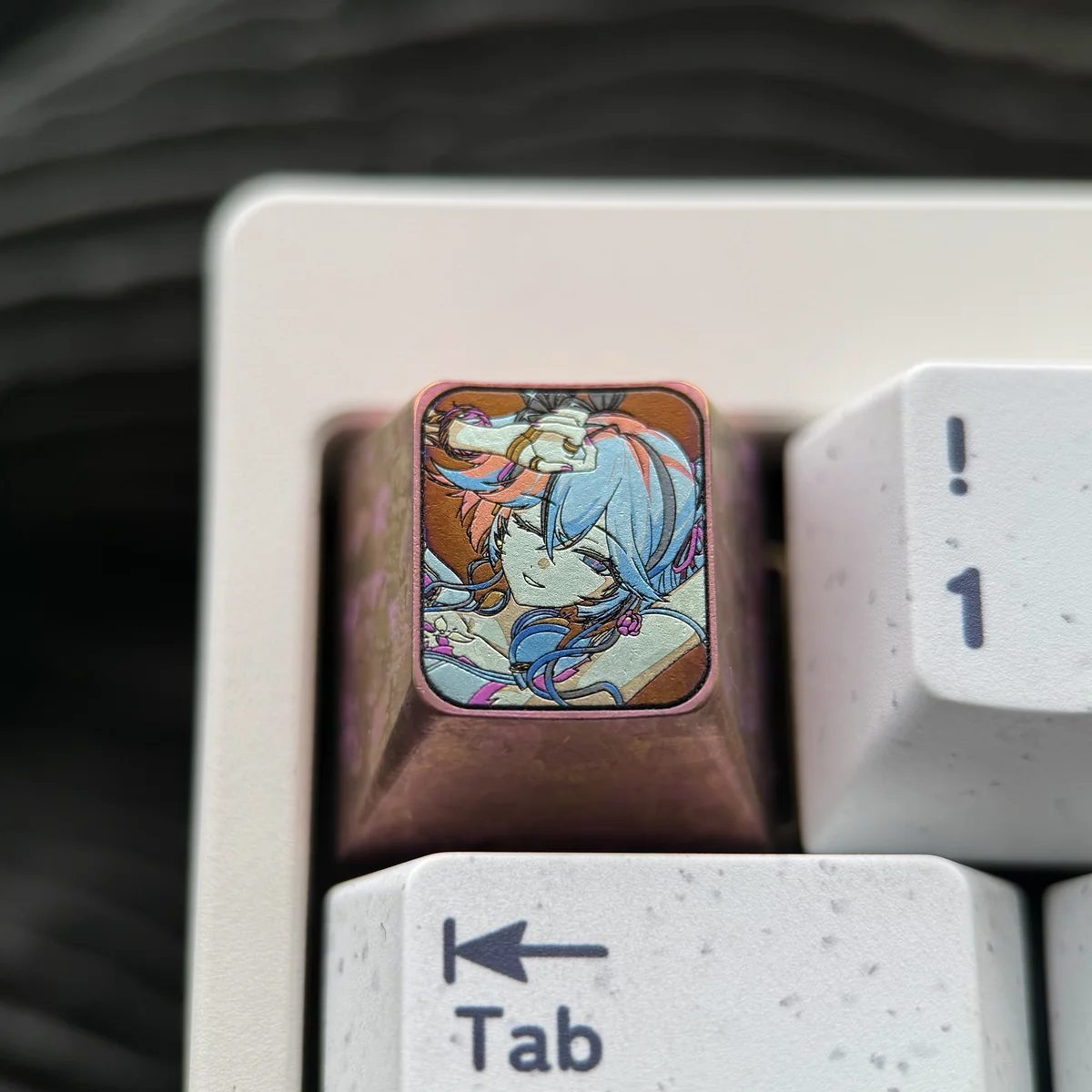 Premium Wuthering Waves Camellya titanium artisan keycap, showcasing its intricate metallic design and brilliant titanium luster.