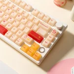 Playful Yakult keycap set gallery showcasing its whimsical bottle design, warm red beige hues, and unique artisan craftsmanship from various angles.